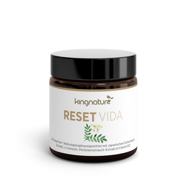 Ein braunes Glas mit schwarzem Deckel und der Aufschrift „Reset Vida“. Das Etikett zeigt grüne Blätter und weist darauf hin, dass es sich um ein Nahrungsergänzungsmittel mit japanischen Rosinen, L-Carnosin und Vitamin B12 handelt.